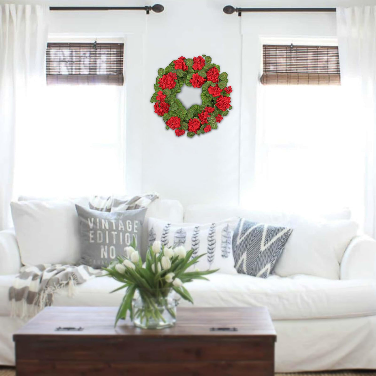Briful geraniums wreath features a dimensional arrangement resembling fresh flowers.
