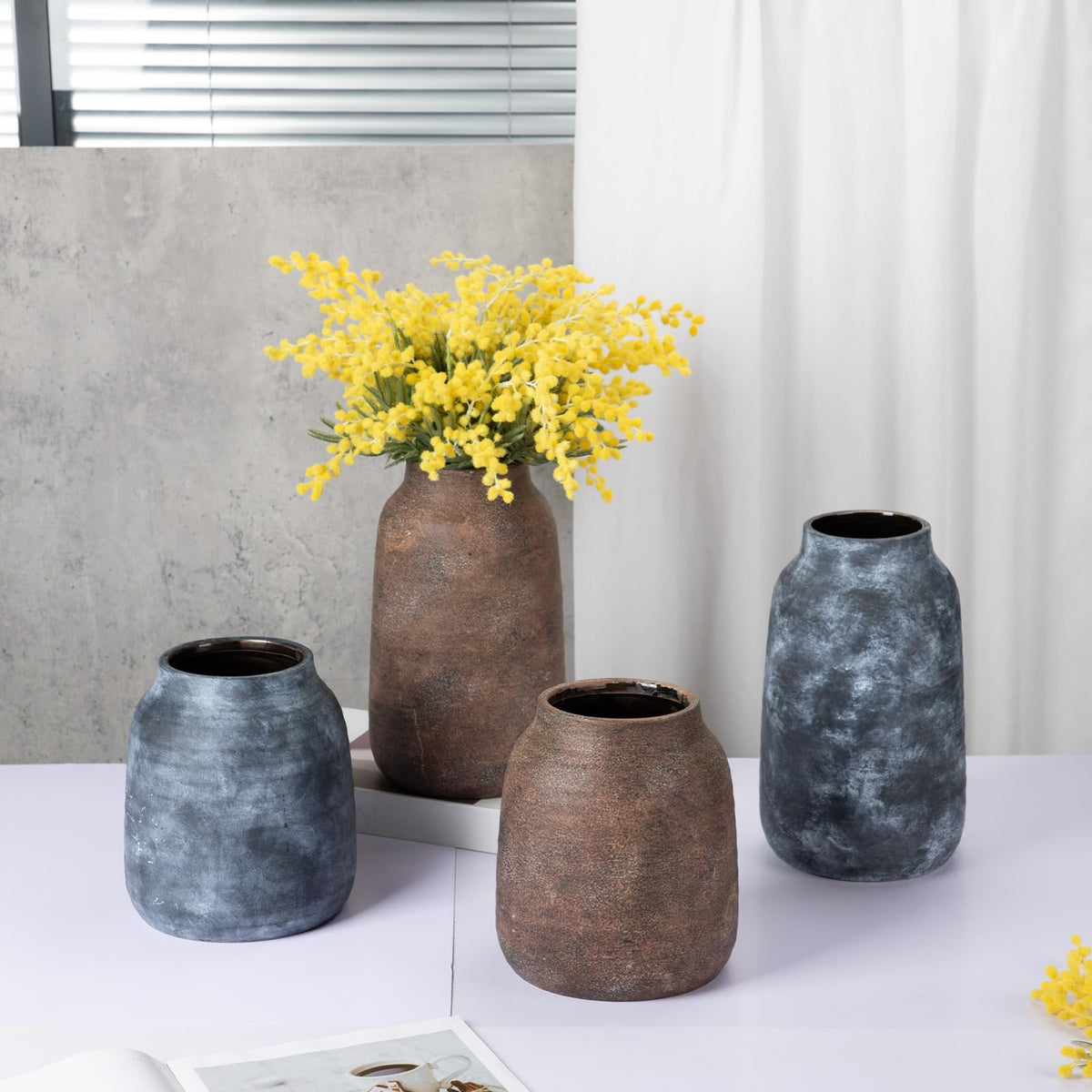 Briful vase with dried stems display adds farmhouse charm to interiors.