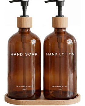 Brighter Barns amber glass soap dispenser with bamboo pump on a stylish bathroom counter.