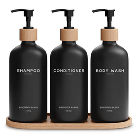 Brighter Barns black shampoo dispenser set bottles and pumps in a modern shower for clutter-free styling.