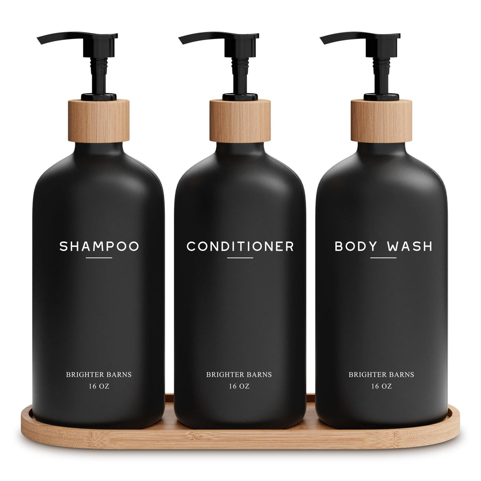 Brighter Barns black shampoo dispenser set bottles and pumps in a modern shower for clutter-free styling.