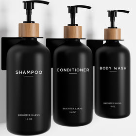 Brighter Barns black 3-chamber shampoo dispenser set mounted on shower wall for clutter-free storage.