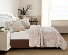 Brilliant Sunshine Quilt folded to reveal reverse rose-bud pattern for two looks.