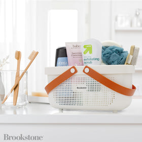 Brookstone BPA-free plastic caddy ensures safe bathroom storage.