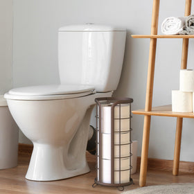 Brookstone bronze toilet paper stand mega-roll capacity keeps spare rolls within reach.