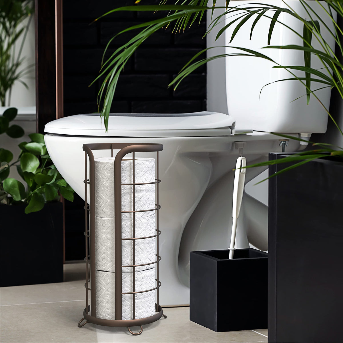 Brookstone bronze toilet paper stand with open-top storage for easy one-handed refills.