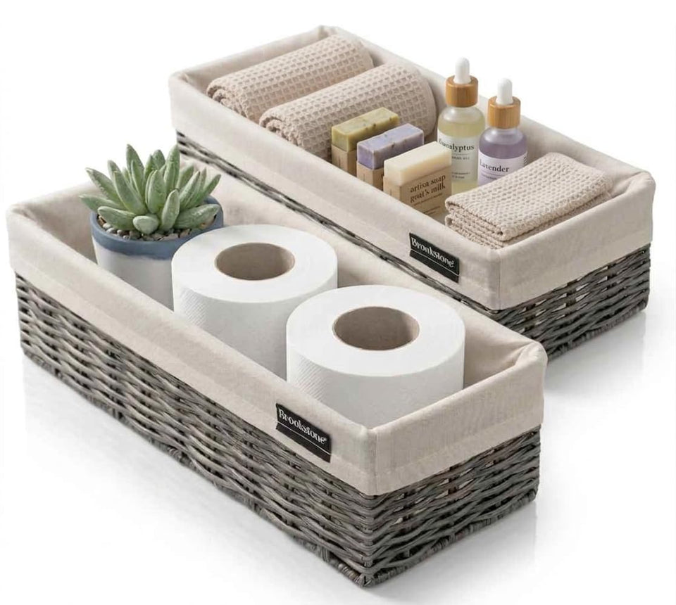 Brookstone over-the-toilet wicker basket in grey for bathroom organization.