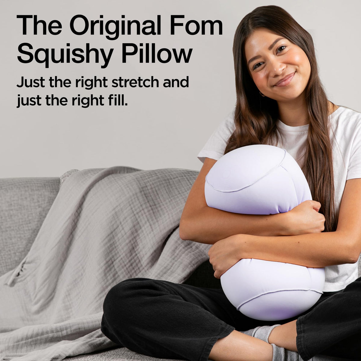 Brookstone Squishy FOM Cushion provides lumbar support in car for longer drives.