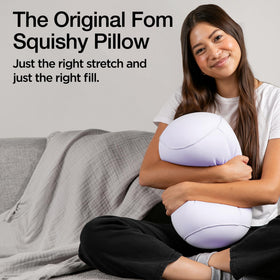 Brookstone Squishy FOM Cushion provides lumbar support in car for longer drives.