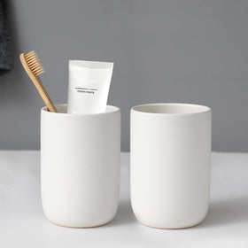 BSDISP two-cup ceramic toothbrush holder set on bathroom counter for organized storage.