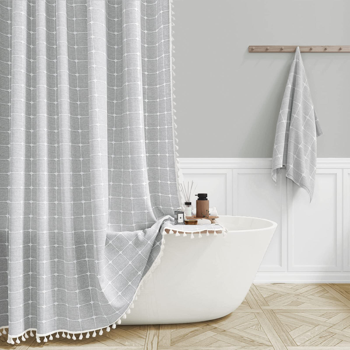 BTTN Boho Farmhouse shower curtain with tassels enhances bathroom decor and luxury.