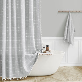 BTTN Boho Farmhouse shower curtain with tassels enhances bathroom decor and luxury.