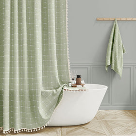 BTTN Boho Farmhouse curtain with tassel trim enhances bathroom privacy.