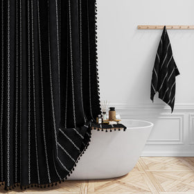 BTTN boho farmhouse shower curtain with tassels enhances decor and style.