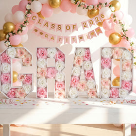 Bucherry grad letter frames on a table offer a chic reusable decor option.