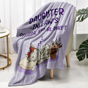 Buioata Daughter-in-Law blanket shown in a reading corner for relaxation.