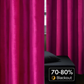Full length BULBUL velvet curtains draped on a rod with elegant flow