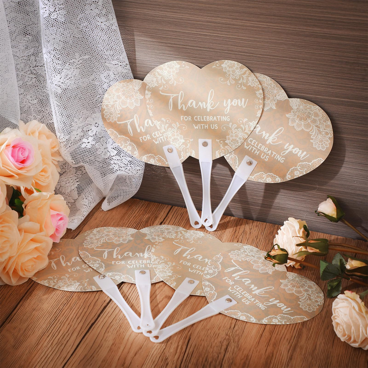 Burbell wedding hand fan showing varied lace patterns for decorative flair