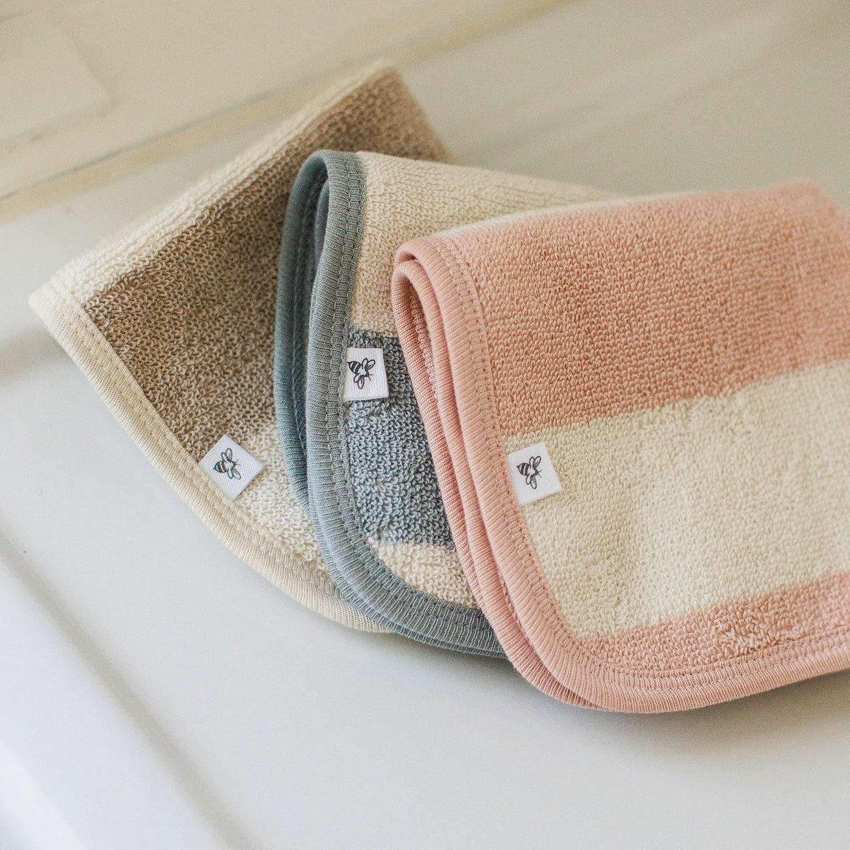 Smooth outside with loop-knit terry on Burt's Bees Baby towel for quick absorption.