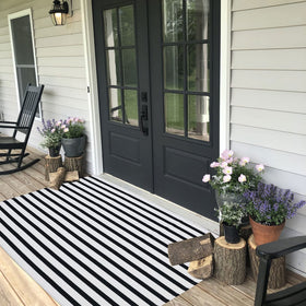 CAINANEL black and white outdoor rug on front porch, durable and stylish