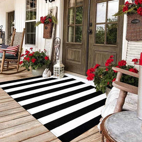 CAINANEL black and white striped front-door mat with durable daily-use protection.