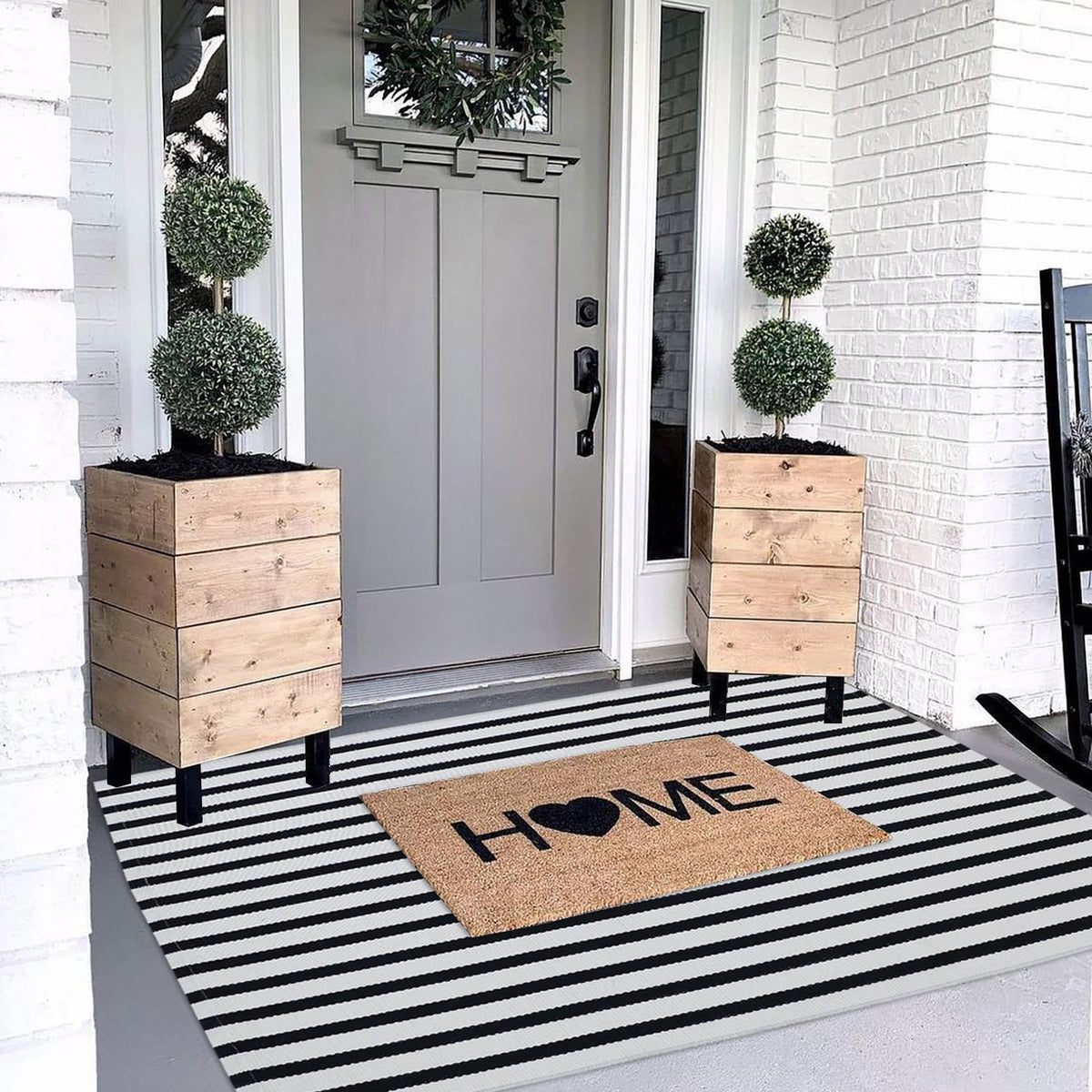 CAINANEL cotton hand-woven welcome mat provides a cozy entryway