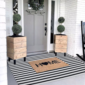 CAINANEL cotton hand-woven welcome mat provides a cozy entryway
