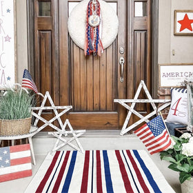 CAINANEL front-porch decor that nods to summer celebrations and family gatherings.