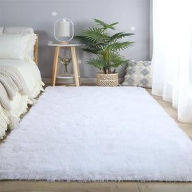 CAIYUECS rug features non-slip backing to stay in place on floors.