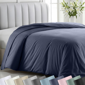 California Design Den indigo dusty blue duvet cover on bed for elegant calm.