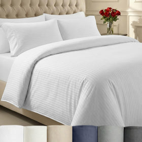 California Design Den stripe duvet cover queen size folded on bed, showing crisp white stripes.