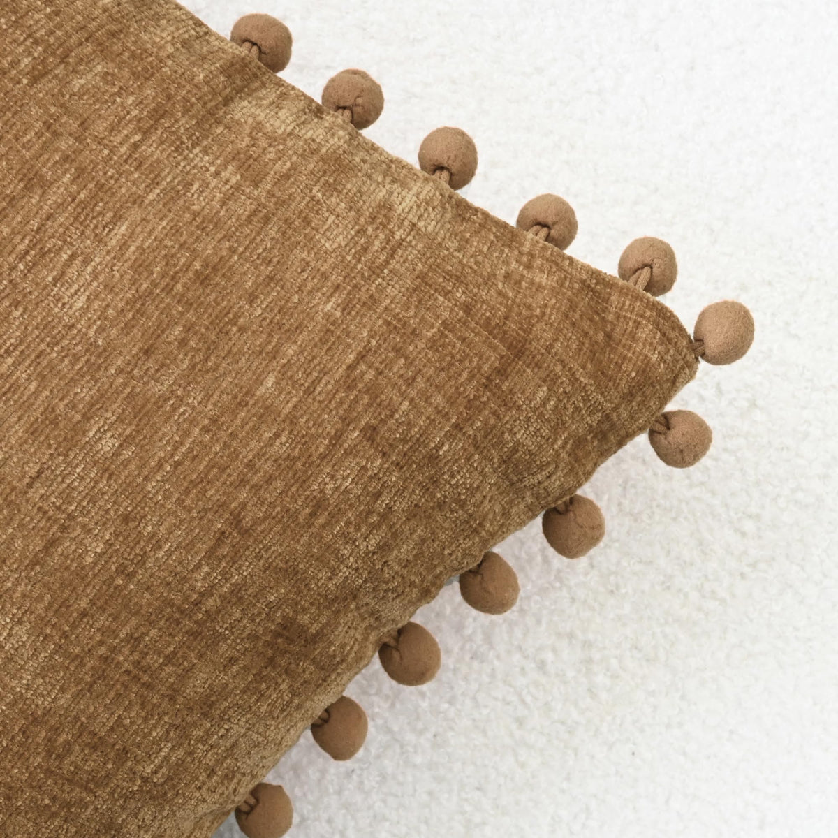 CaliTime pillow cover with pom-poms adds decorative texture to sofas.