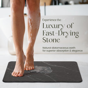 Calivio charcoal diatomite mat on tile floor for a hygienic, moisture-free entry.