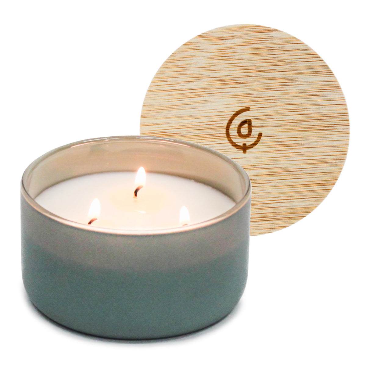 Calyan Wax Co. Evergreen-Eucalyptu candle in a glass jar for luxurious living room ambiance.