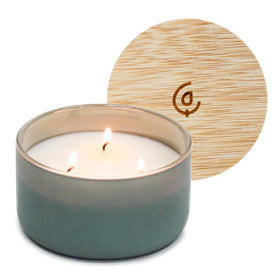 Calyan Wax Co. Evergreen-Eucalyptu candle in a glass jar for luxurious living room ambiance.