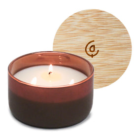 Calyan Wax Co. Mahogany & Cashmere 3-Wick bottle glows with inviting warmth for evenings