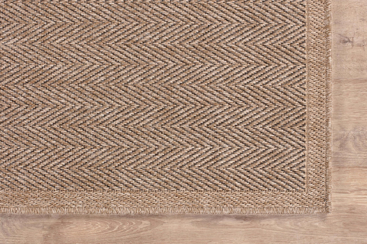 CAMILSON Easy Jute Rug has a low 0.3-inch pile for easy chair clearance.