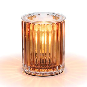 Candeldo wax melt warmer on a table boosts cozy ambience.