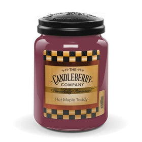Candleberry Hot Maple Toddy jar front view in a warm living room for cozy ambiance.