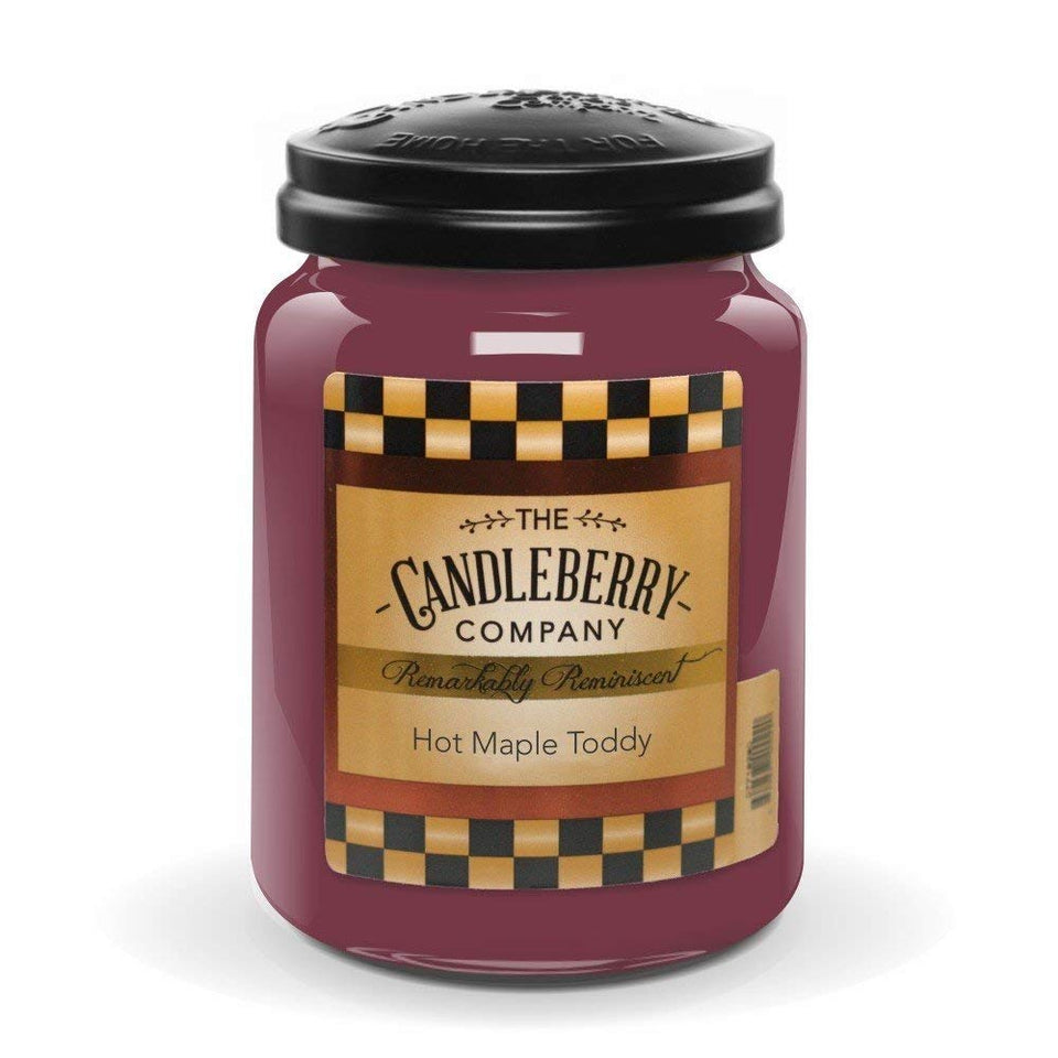 Candleberry Hot Maple Toddy jar front view in a warm living room for cozy ambiance.
