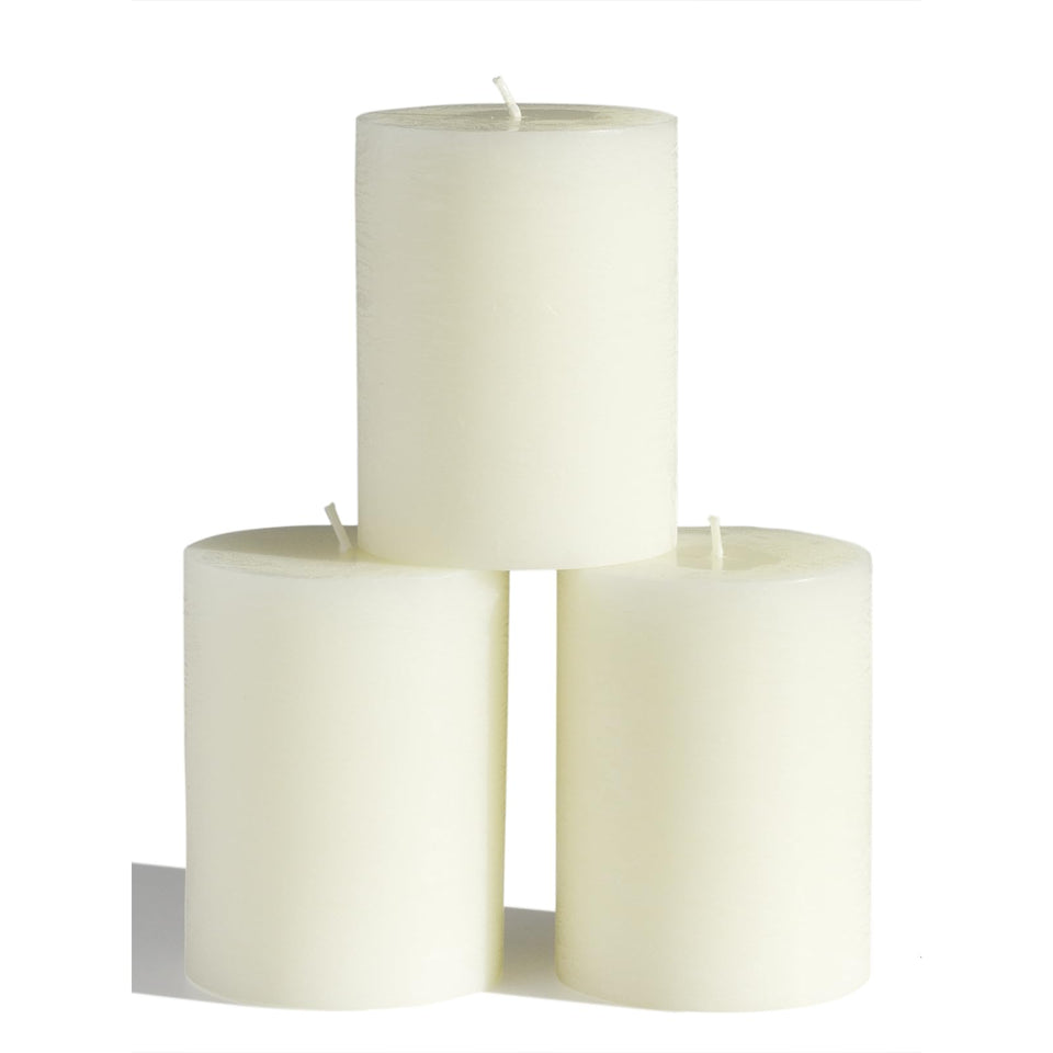 CandWAX 3x4 inch ivory pillar candle set on a plate for elegant decor.