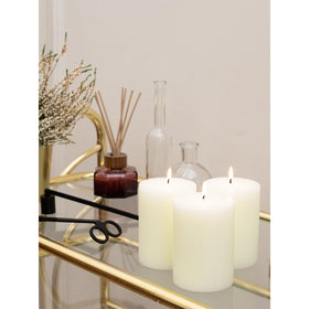 CandWAX ivory pillar candle with 55 hour burn time for extended ambiance.