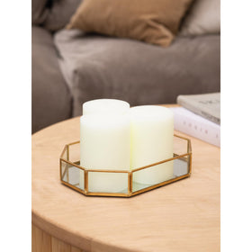 CandWAX ivory pillar candle on a holder for table centerpieces.