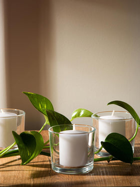 CANDWAX unscented votives create warm mood lighting for spa and events.