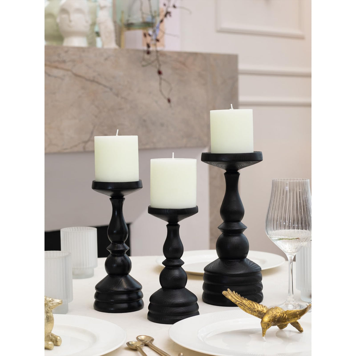 Wedding centerpiece featuring CandWAX ivory pillar candles