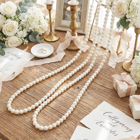 Canlierr 2-strand pearl garland creates a lush wedding backdrop for photos