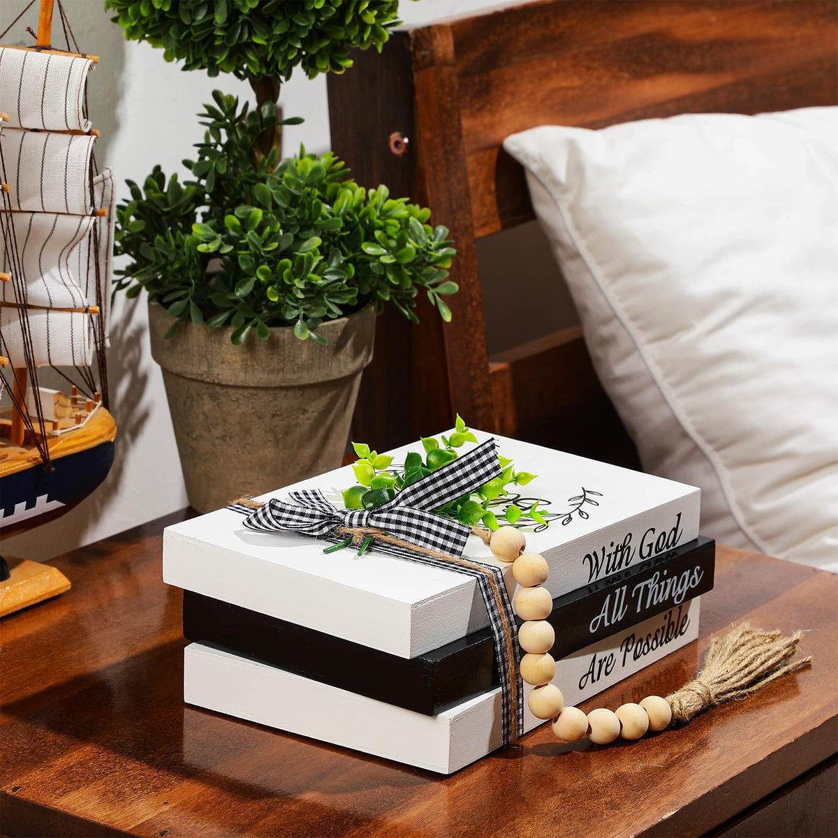 Capoda decorative books with faux leaf accent adds natural elegance.