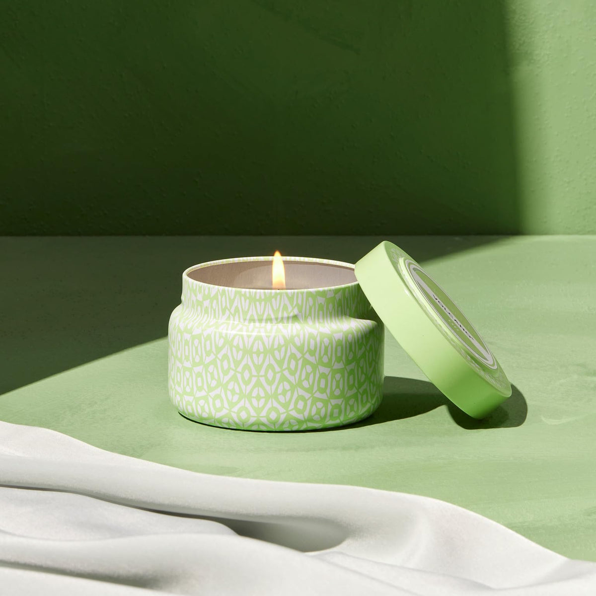 Capri Blue Volcano Iced Matcha Green candle brings chic ambiance on the go.