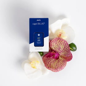 Capri Blue Pura refill vial close-up shows crisp apple and spice notes