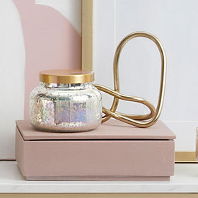 Capri Blue Signature iridescent jar showcased as a luxe centerpiece option.